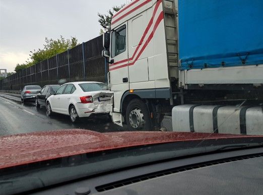 semi truck crashing into passenger car